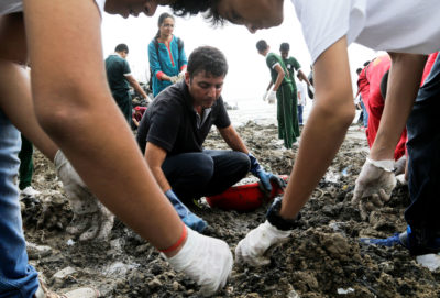 Since 2016, volunteers organized by environmentalist Afroz Shah (center) have picked up some 35 million pounds of waste — 95 percent of which has been plastic — from Versova Beach in Mumbai.